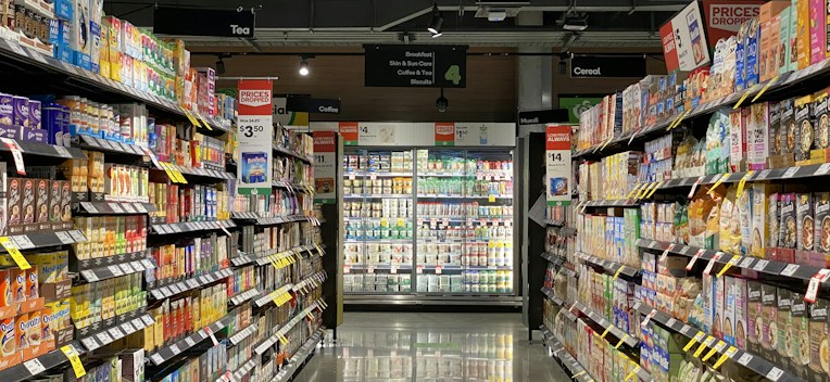 A supermarket aisle stocked with packaged goods
