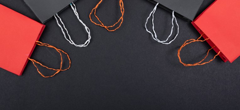 Retail shopping bags on a dark surface